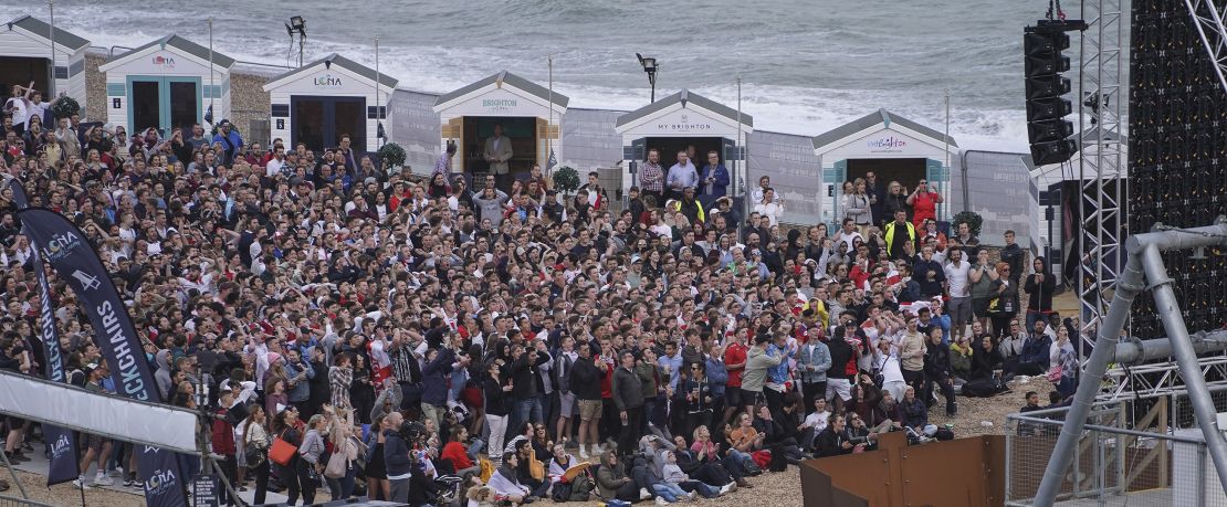 Football fans watch the match inside the Lunar Beach Cinema on Brighton beach as England play Tunisia in the group stages of the 2018 FIFA World Cup.