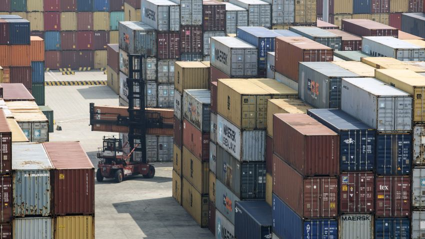 A reach stacker transports a shipping container in a terminal at the Yangshan Deep Water Port in Shanghai, China, on Friday, March 23, 2018. The trade conflict between China and the U.S. escalated, with Beijing announcing its first retaliation against metals levies hours after President Donald Trump outlined fresh tariffs on $50 billion of Chinese imports and pledged there's more on the way. Photographer: Qilai Shen/Bloomberg via Getty Images