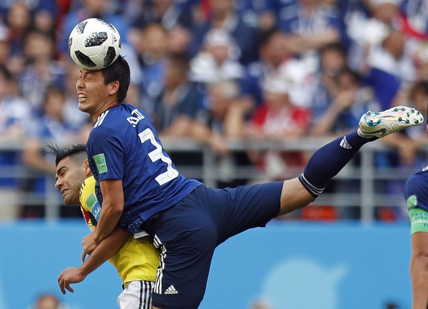 Japanese defender Gen Shoji climbs over Colombia's Radamel Falcao to win a header in their World Cup opener on June 19. Japan won the match 2-1.