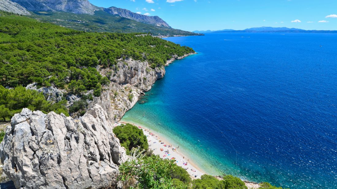 <strong>Nugal Beach:  </strong>Makarska's most scenic beach comes with its own 30-foot waterfall, which is bolstered by a stream coming down from Mount Biokovo and flowing down the rock face into the sea. 