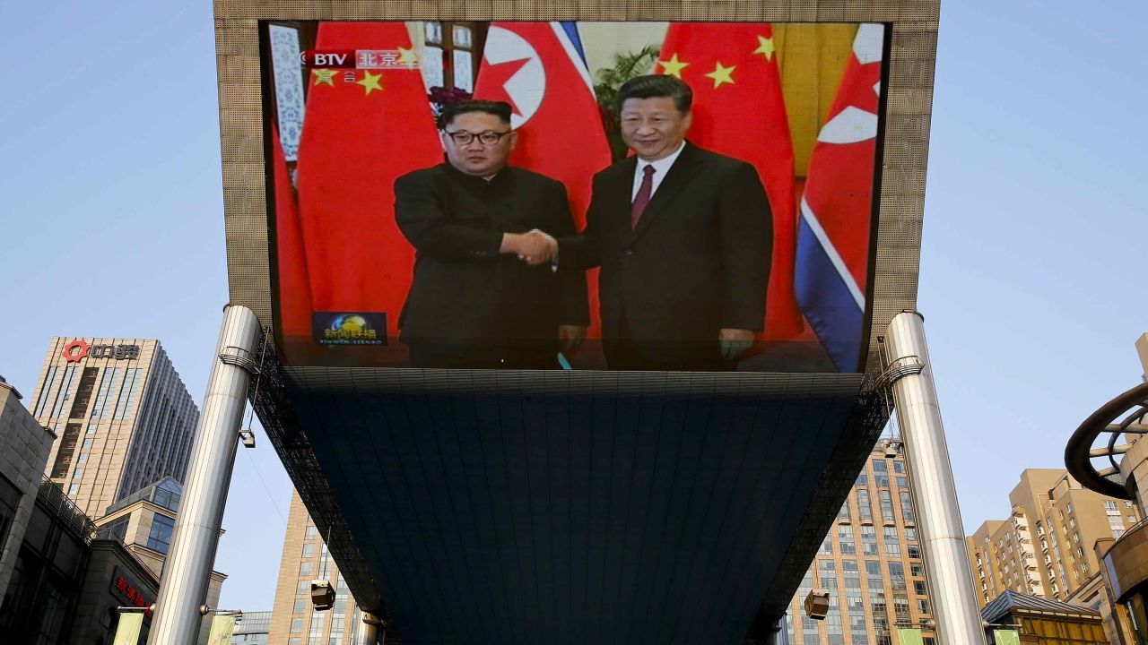 A giant TV screen broadcasting the meeting of Kim Jong Un and Xi Jinping on Tuesday.
