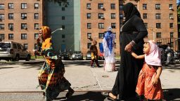 NEW YORK, NY - JUNE 15:  West African women gather after participating in an outdoor prayer event at Masjid Aqsa-Salam mosque, Manhattan's oldest West African mosque, to mark the end of Ramadan on June 15, 2018 in New York City. The annual event in Harlem attracts hundreds of worshippers for the Eid Al-Fitr prayer event in front of the mosque. Around the world Muslims are marking the end of Ramadan, the holy month of fasting, with feats, prayer and family gatherings.  (Photo by Spencer Platt/Getty Images)
