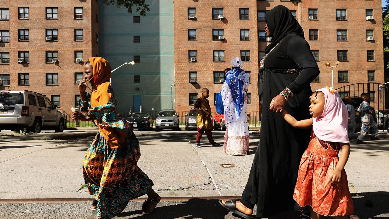 West African women after participating in an outdoor prayer event  to mark the end of Ramadan on June 15 in New York City.