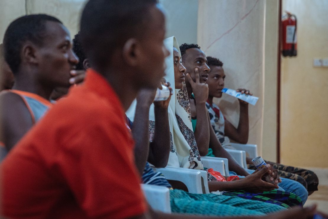 Migrants at an IOM Migration Reception Point, where they receive medical check-ups and other assistance.