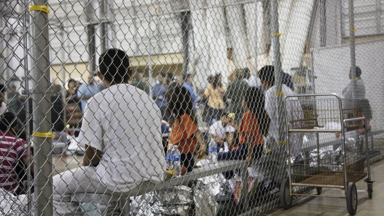 In this photo provided by U.S. Customs and Border Protection, people who've been taken into custody related to cases of illegal entry into the United States, sit in one of the cages at a facility in McAllen, Texas, Sunday, June 17, 2018. (U.S. Customs and Border Protection's Rio Grande Valley Sector via AP)