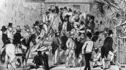 circa 1860:  Slaves being sold at Charleston, South Carolina. Original Artwork: Engraving by Eyrecrowe.  (Photo by Rischgitz/Getty Images)