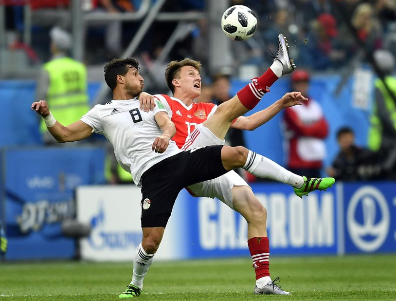 Egypt's Tarek Hamed, left, and Russia's Aleksandr Golovin compete for the ball.