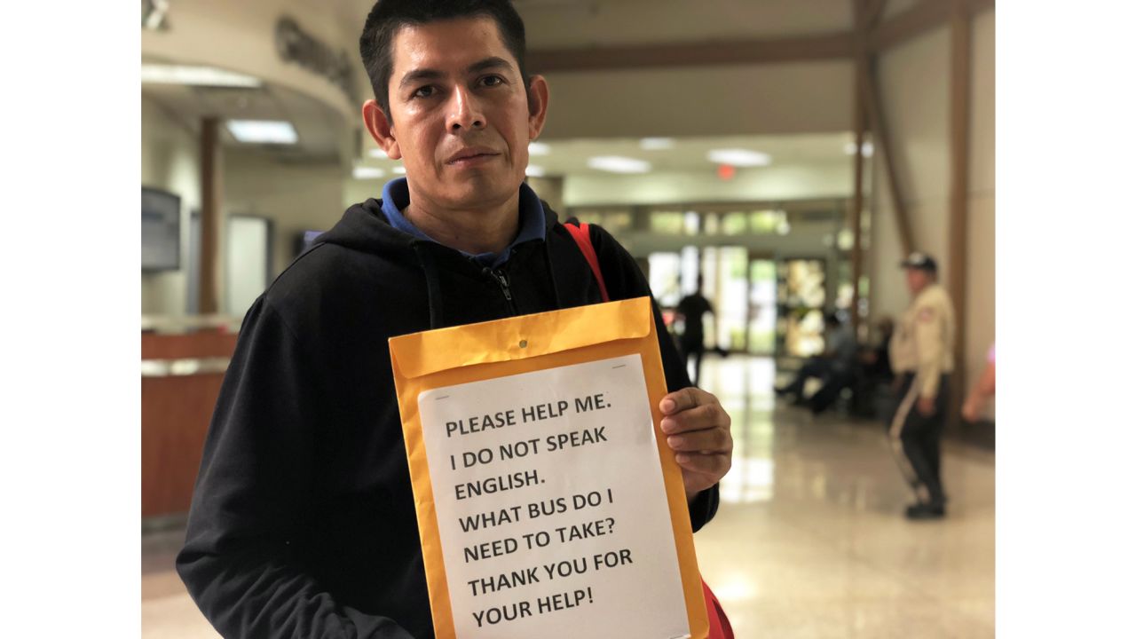 Gonzalez displays a sign that he hopes will help him navigate his journey from Texas to Florida.