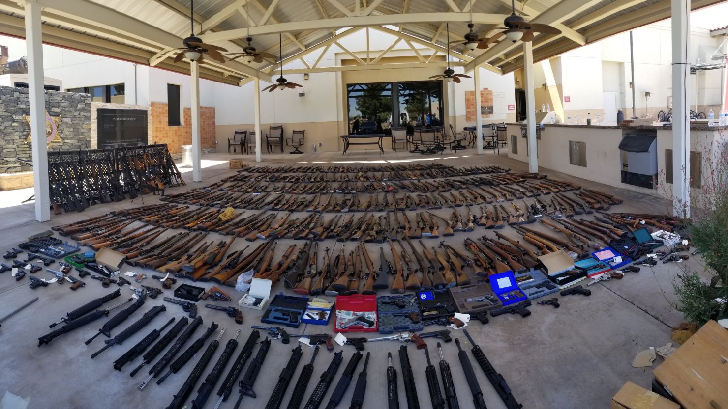 Officials confiscated guns, ammunition, computers and other evidence.