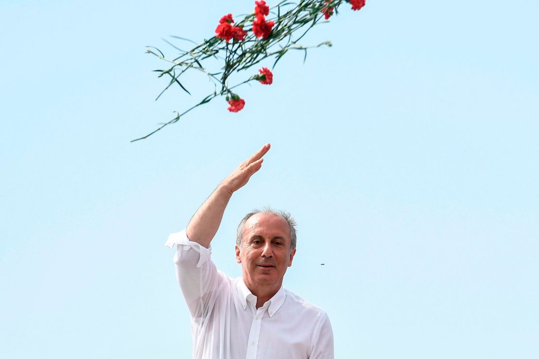 Presidential candidate Muharrem Ince throws carnations to his supporters at an election event in Istanbul on June 16.