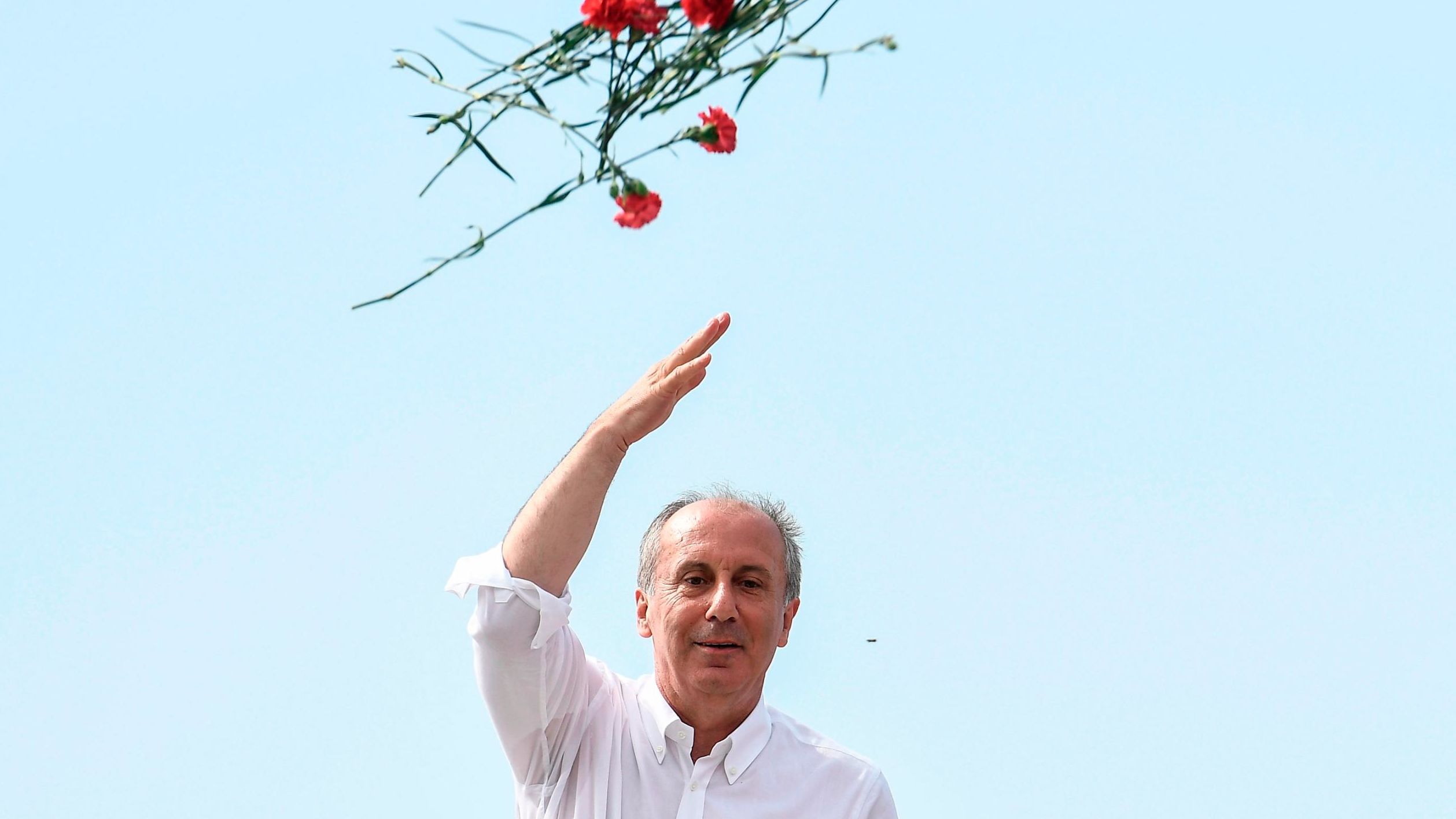 Presidential candidate Muharrem Ince throws carnations to his supporters at an election event in Istanbul on June 16.