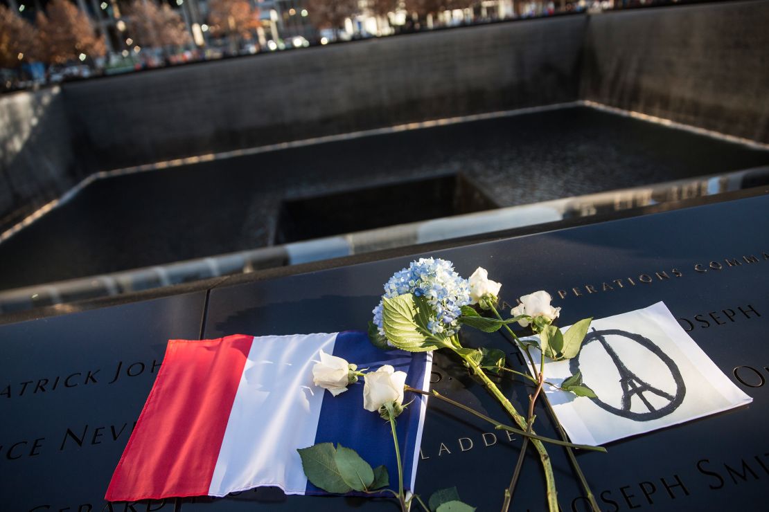 A modified version of the peace symbol showing the Eiffel tower at the September 11 Memorial in New York City honors the lives lost in the Paris attacks of Nov. 13, 2015.