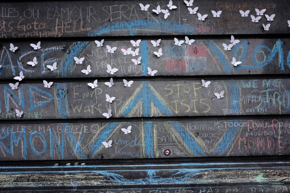 The peace symbol written with chalk is seen on a wall on the Place de la Bourse in central Brussels in a 2016 tribute to the victims of the Brussels attacks.