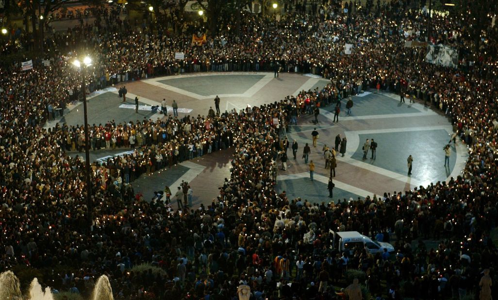 Thousands of people demonstrate by forming a peace symbol at Catalunya Square in Barcelona against the US-led war in Iraq in 2003. 
