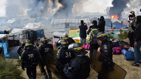 French anti-riot police officers arrive in October 2016 to clear the Calais "Jungle". 
