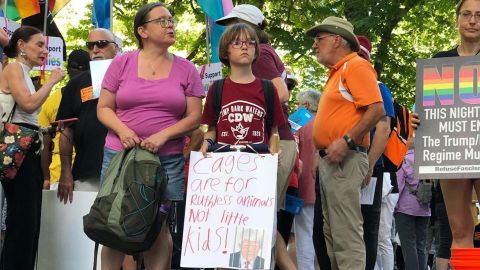 Protesters in Philadelphia hold signs expressing their opposition to the Trump administration's zero tolerance immigration policy