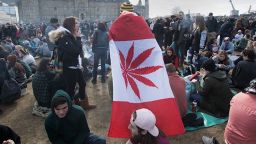 A man wears a Canadian maple leaf flag with marijuana leaf during the annual 4/20 rally on Parliament Hill in Ottawa in 2018.