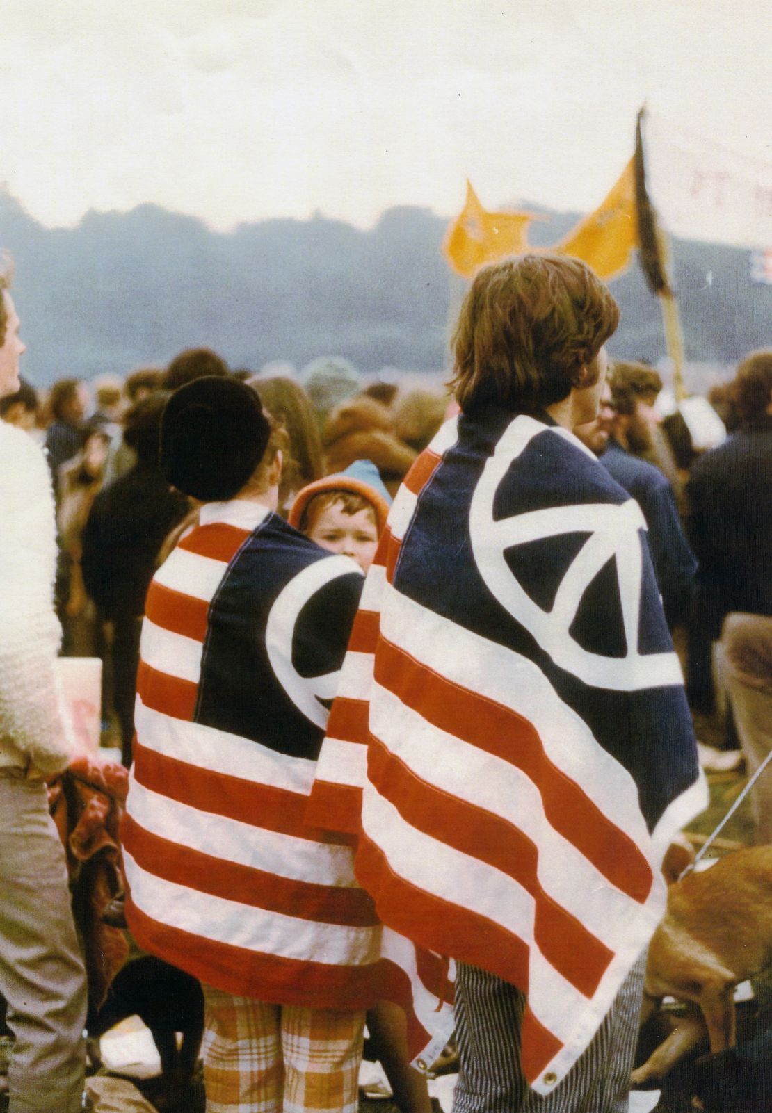 A couple wears an American flag modified with the peace symbol in an anti-Vietnam war  protest in San Fracisco on Nov. 15, 1969.