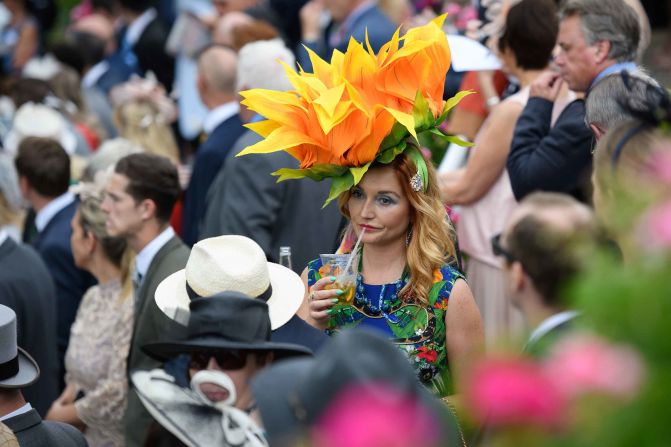 A woman wears a particularly large floral hat during day one of Royal Ascot.