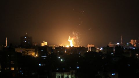 An explosion is seen in northern Gaza City after an airstrike by Israeli forces on June 20, 2018.