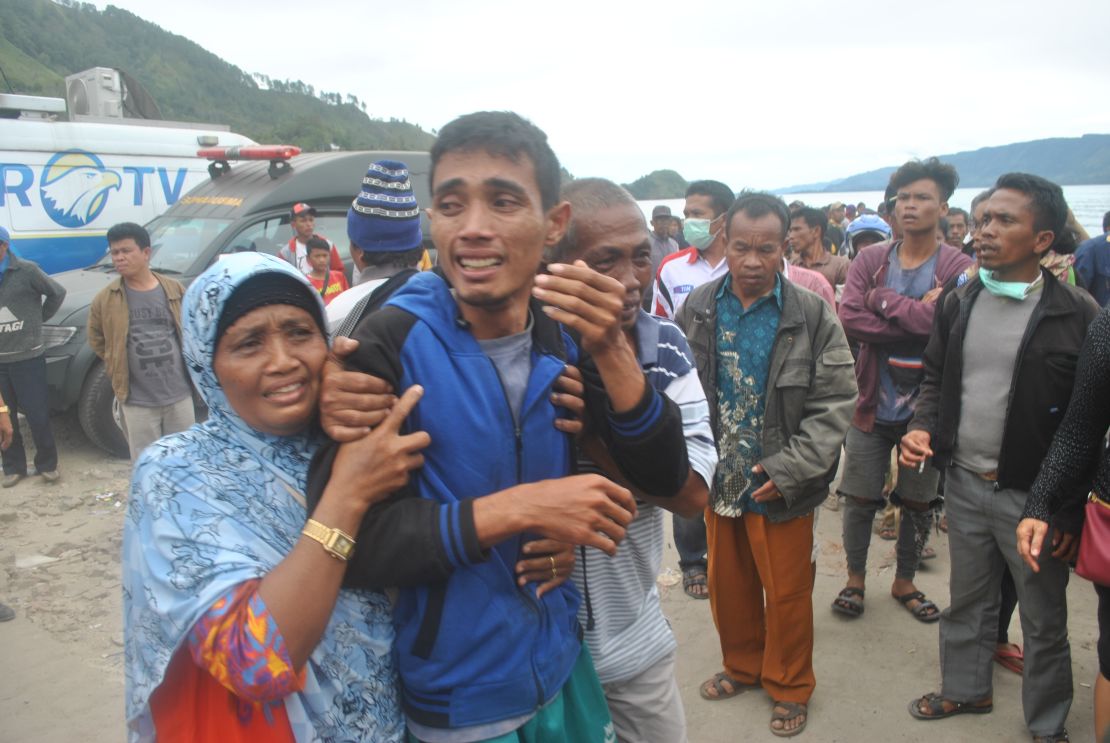 Families await news of their loved ones, thought to have drowned aboard the stricken tourist ferry.