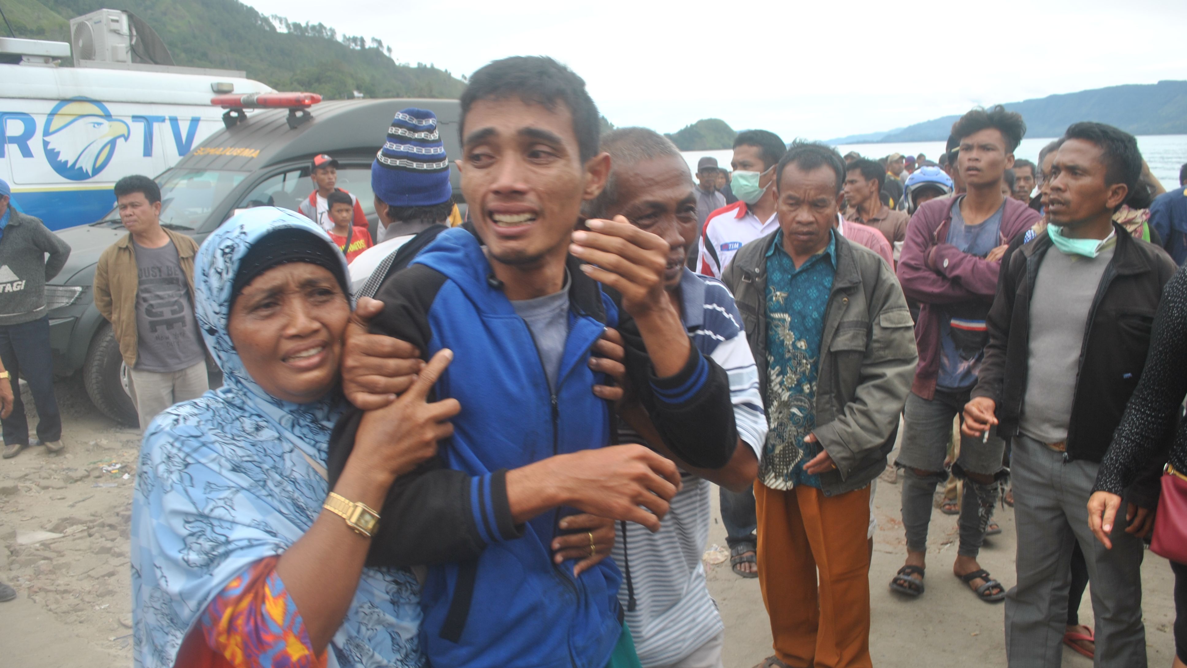 Families await news of their loved ones, thought to have drowned aboard the stricken tourist ferry.