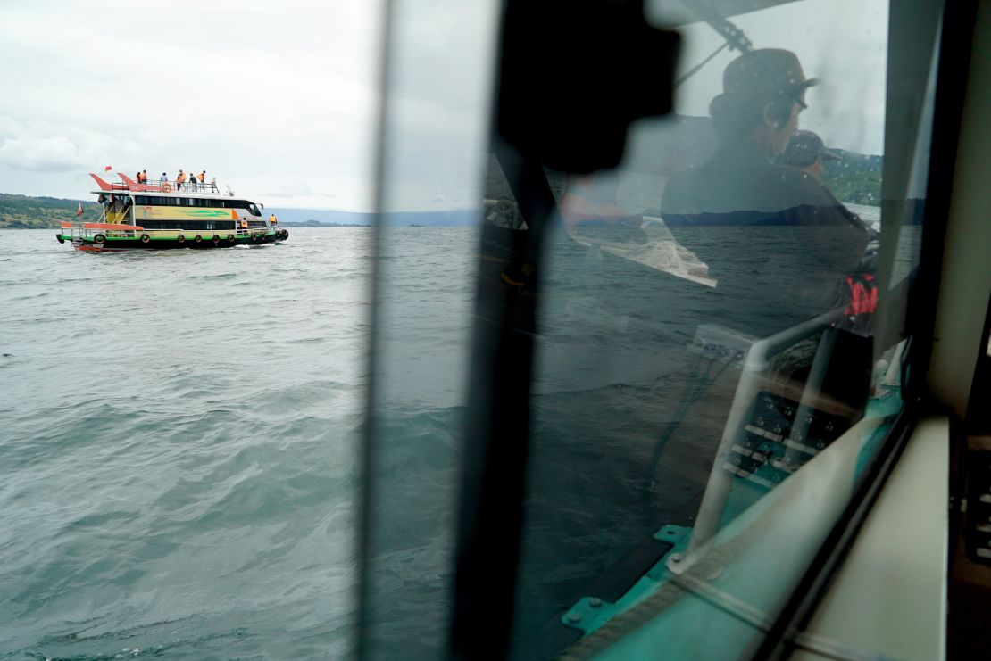 Rescue teams search for victims at the Lake Toba ferry port in the province of North Sumatra.
