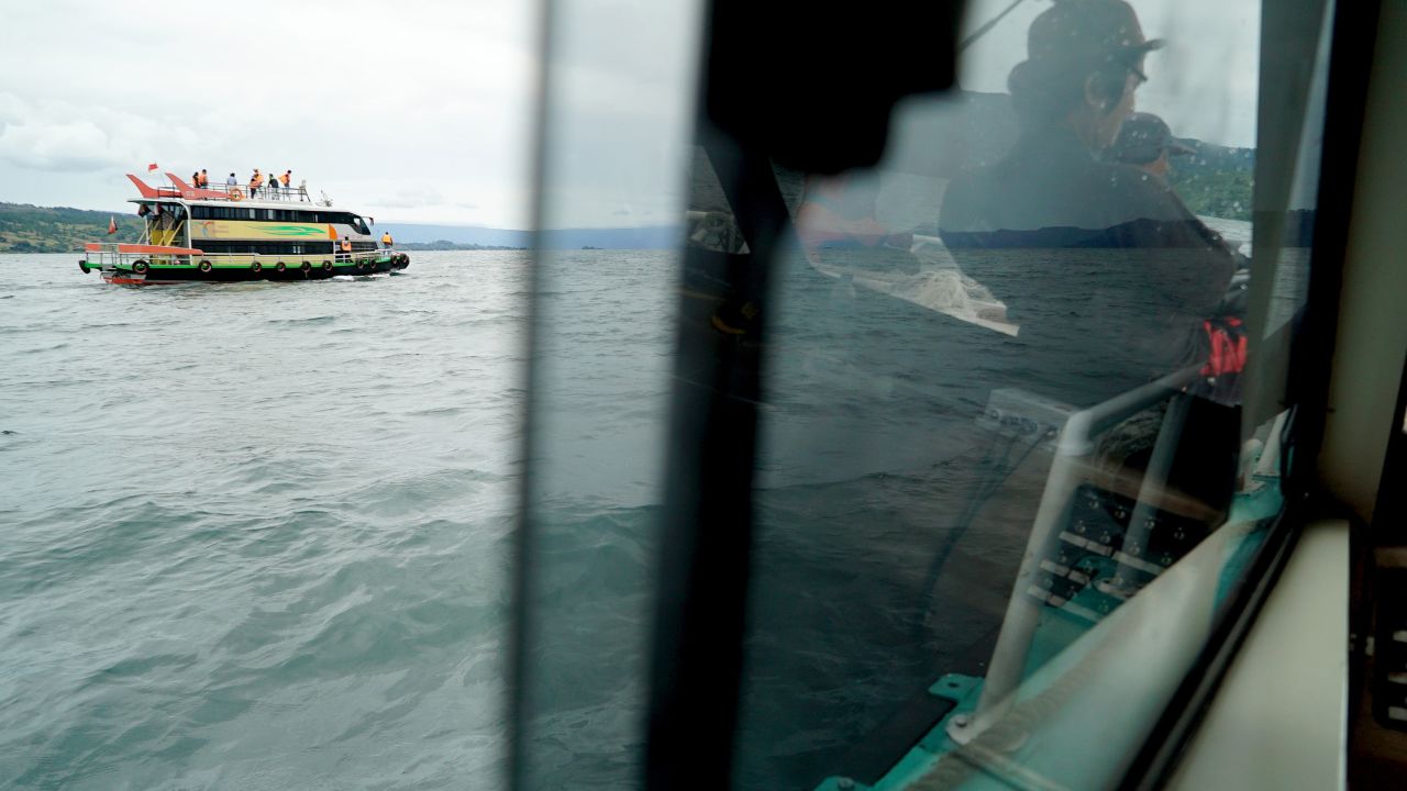 Rescue teams search for victims at the Lake Toba ferry port in the province of North Sumatra.
