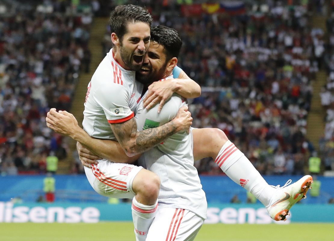 Diego Costa celebrates his winning goal with Isco.