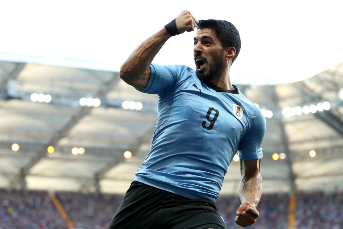 Unmarked in the box, Suarez scored a record-breaking goal