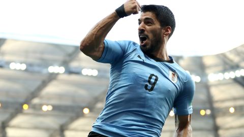 Unmarked in the box, Suarez scored a record-breaking goal