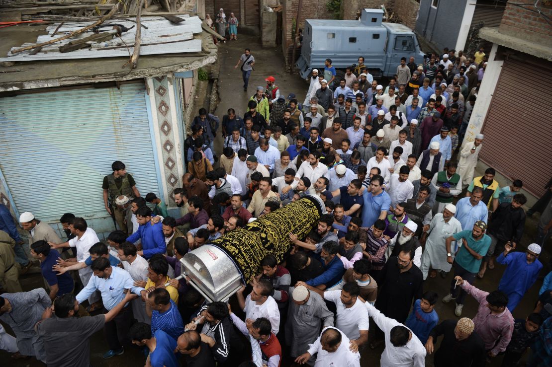 Kashmiri Muslims carry the coffin of Shujaat Bukhari, slain editor-in-chief of the Rising Kashmir  newspaper in Kreeri  on June 15, 2018.