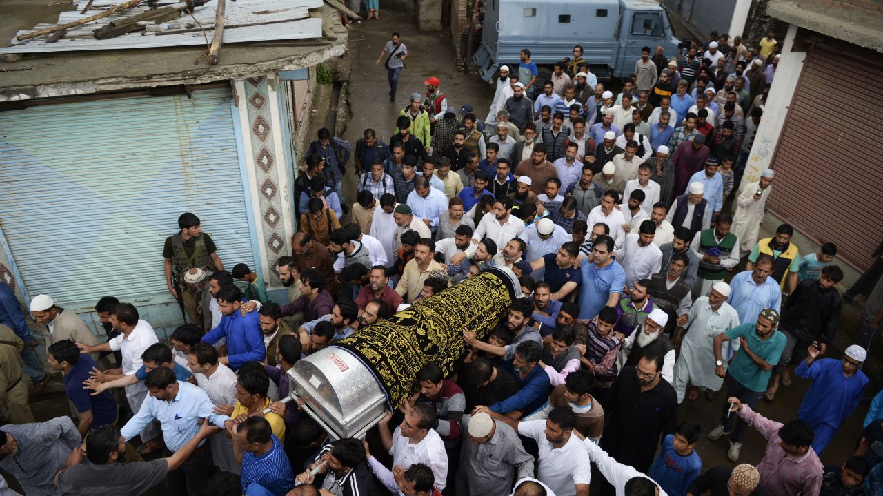 Kashmiri Muslims carry the coffin of Shujaat Bukhari, slain editor-in-chief of the Rising Kashmir  newspaper in Kreeri  on June 15, 2018.