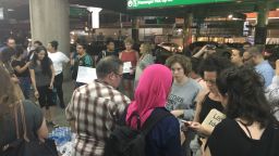 People gathered at LaGuardia Airport where it is believed some immigrant children have arrived earlier Wednesday night.