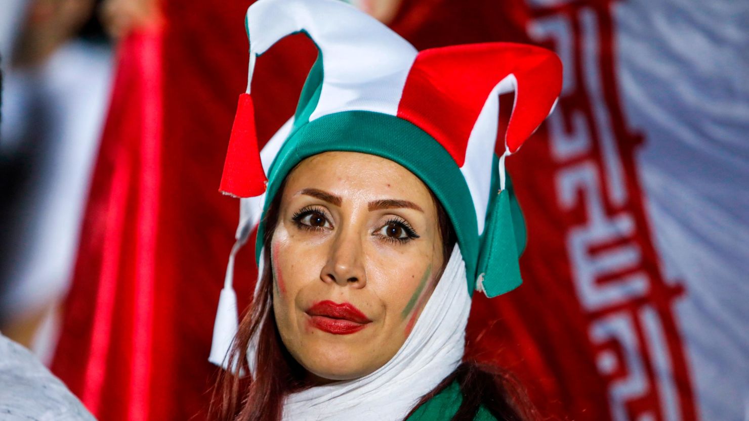 Am Iranian woman cheers for her national team during Wednesday's screening at Azadi Stadium.
