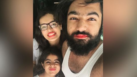 Diksha Bijlani, left, her brother Geet Bijlani, right, and another cousin, center, wear pink lipstick to support their young cousin.