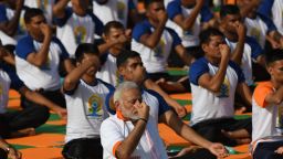 Indian Prime Minister Narendra Modi leads volunteers in breathing exercises on the fourth anniversary of International Yoga Day
