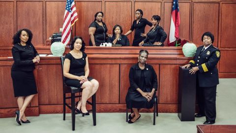 These women hold the reins of power in the municipal criminal justice system of South Fulton, Georgia. Foreground, from left, LaDawn Jones, Lakesiya Cofield, Viveca Famber Powell, interim Police Chief Sheila Rogers. Background, from left, clerk Kerry Stephens, Chief Judge Tiffany Carter Sellers, clerk Ramona Howard, clerk Tiffany Kinslow