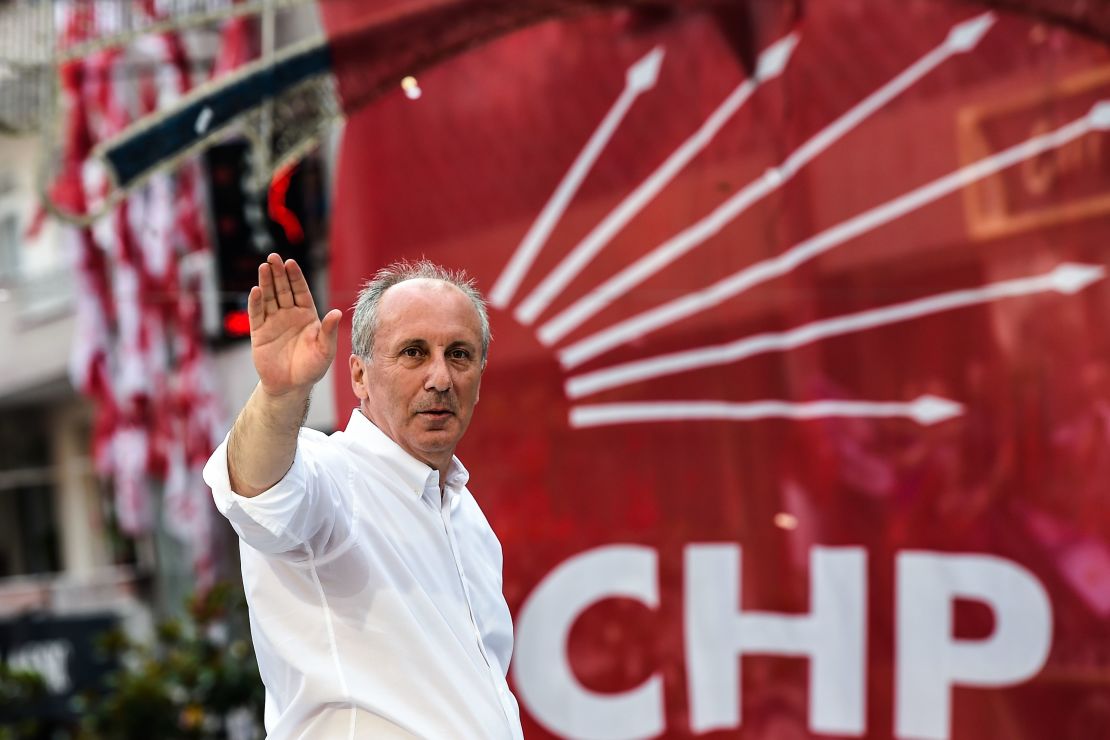 Muharrem Ince waves to supporters from the roof of a campaign bus on June 10 in Istanbul.