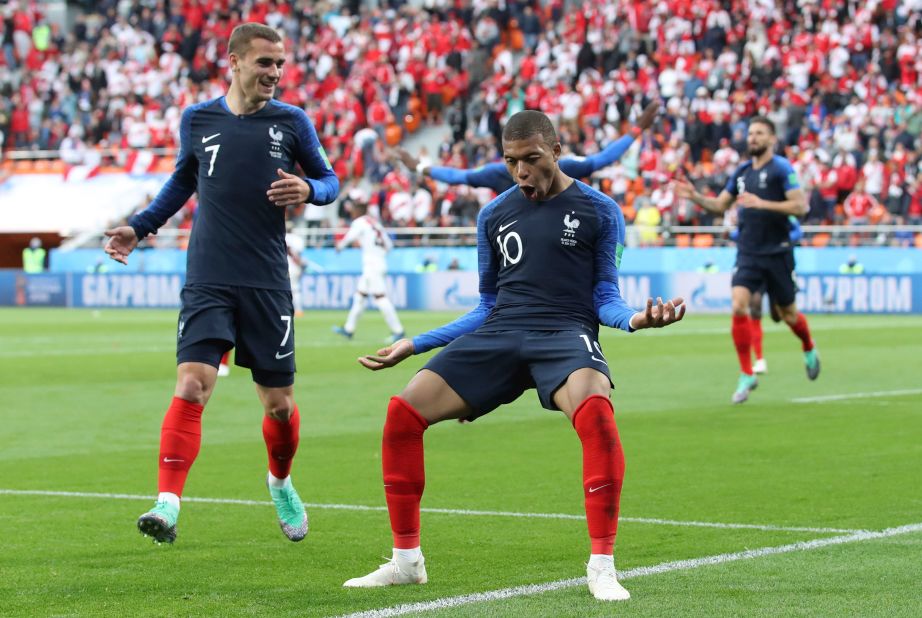 France's Kylian Mbappe, right, celebrates with teammate Antoine Griezmann after scoring against Peru on June 21. It was the only goal of the match.