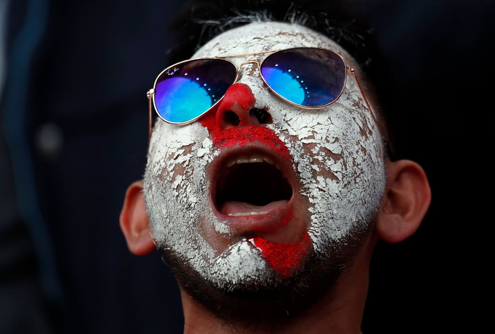 A Peruvian supporter waits for the start of the match.