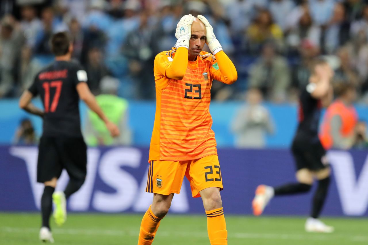 Willy Caballero is dejected after his flubbed clearance gifted Croatia its first goal.