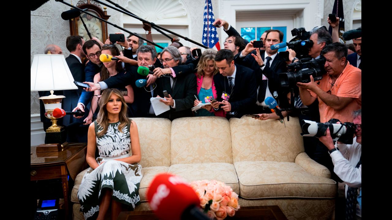 Journalists crowd around first lady Melania Trump in the White House Oval Office on Tuesday, June 19. She and her husband were meeting with Spain's King Felipe VI and Queen Letizia.