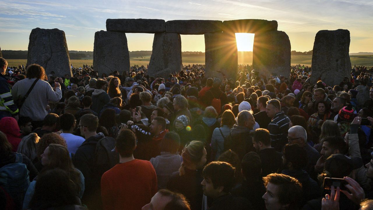 Sunlight filters through Stonehenge as people gather to celebrate the <a href="https://www.cnn.com/travel/article/summer-solstice-world-traditions/index.html" target="_blank">summer solstice</a> in Wiltshire, England, on Thursday, June 21.