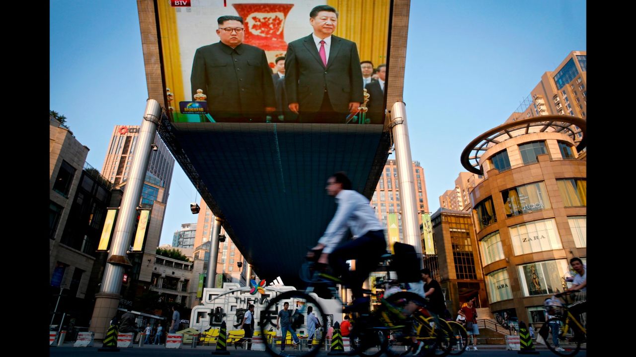 A giant television screen in Beijing broadcasts<a href="https://www.cnn.com/2018/06/18/asia/kim-jong-un-china-intl/index.html" target="_blank"> the meeting of Chinese President Xi Jinping and North Korean leader Kim Jong Un</a> on Tuesday, June 19. It was their third meeting in as many months. According to state media, the two men agreed they wanted to further deepen the already-close ties between Beijing and Pyongyang.