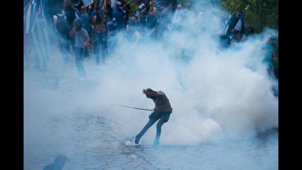 A protester kicks a tear-gas canister thrown by police during clashes in Pisoderi, Greece, on Sunday, June 17. Greece and Macedonia <a href="https://www.cnn.com/travel/article/macedonia-changes-name-intl/index.html" target="_blank">signed a historic agreement</a> to rename the latter the Republic of North Macedonia, possibly putting end to a dispute that has soured relations between the two countries for decades. But not everyone is happy with the deal.