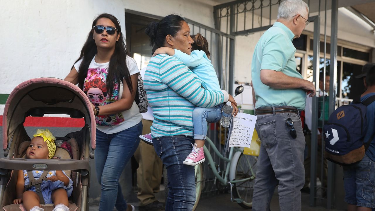 CIUDAD JUAREZ, MEXICO - JUNE 20:  Angelica (C) (who didn't want her last name used) holds her grandchild as they enter the Paso Del Norte Port of Entry to ask for asylum in the United States on June 20, 2018 in Ciudad Juarez, Mexico. The Trump Administration's controversial zero tolerance immigration policy has led to an increase in the number of migrant children who have been separated from their families at the southern U.S. border. U.S. Attorney General Jeff Sessions has added that domestic and gang violence in immigrants' country of origin would no longer qualify them for political asylum status. (Photo by Joe Raedle/Getty Images)