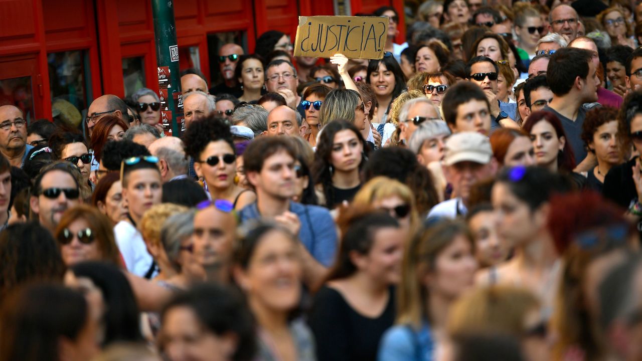 A woman holds up a sign reading ''Justice?'' at a protest Thursday in Pamplona.