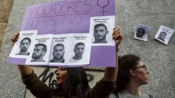 MADRID, SPAIN - APRIL 26:  A protester holds a placard with pictures depicting the members of 'La Manada' during a demonstration against the verdict of the 'La Manada' (Wolf Pack) gang case outside the Minister of Justice on April 26, 2018 in Madrid, Spain. The High Court of Navarra has given a sentence of 9 years in prison to five men for 'continued sexual abuse' instead of 'rape', which would have seen them recieve around 22 years in prison. The gang assaulted an 18-year-old woman in Pamplona, during the San Fermin Festival in 2016. Feminists and women's rights groups have called for demonstrations across Spain.  (Photo by Pablo Blazquez Dominguez/Getty Images)