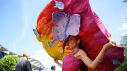 ASCOT, ENGLAND - JUNE 21:  A racegoer wears an outsize hat for Ladies Day during Royal Ascot Day 3 at Ascot Racecourse on June 21, 2018 in Ascot, United Kingdom. Royal Ascot is Britain's most valuable race meeting, attracting many of the world's finest racehorses to compete for more than £7.3m in prize money.  (Photo by Leon Neal/Getty Images)